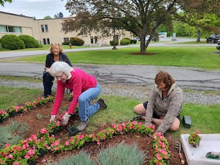 Linda L., Jocelyn, & Helen planting begonias